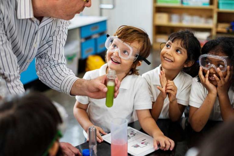 pupils in science lesson with teacher