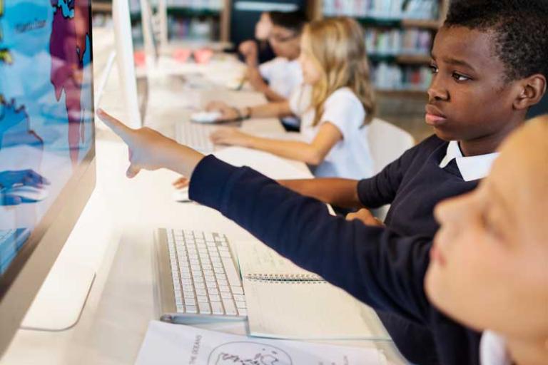 students using computers in class