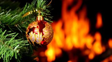 Christmas Bauble with open fire in background