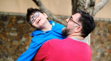 father and son smiling