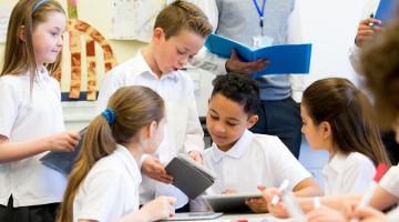 children reading in a classroom